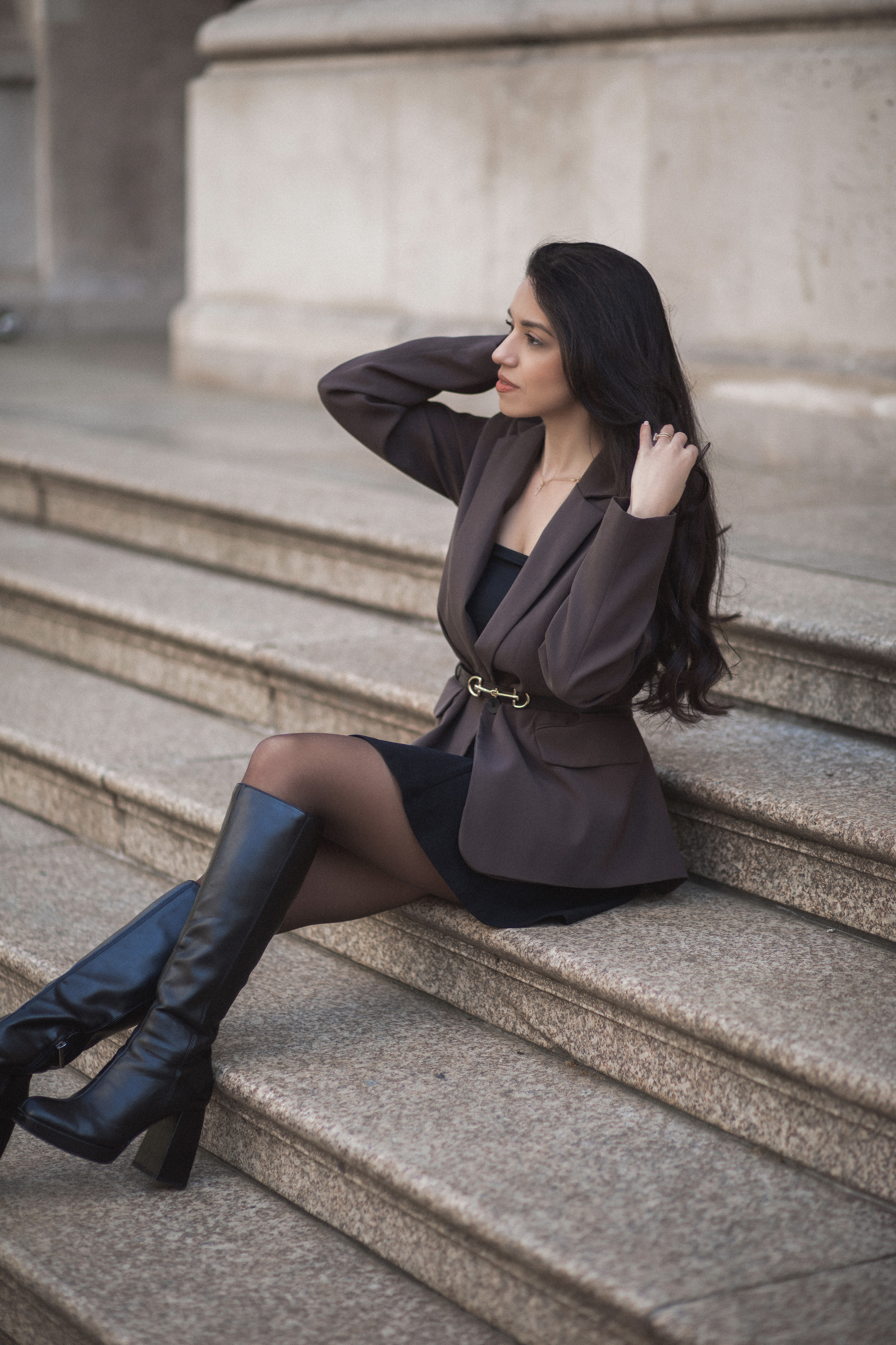The founder of Novacreas sitting on stone steps